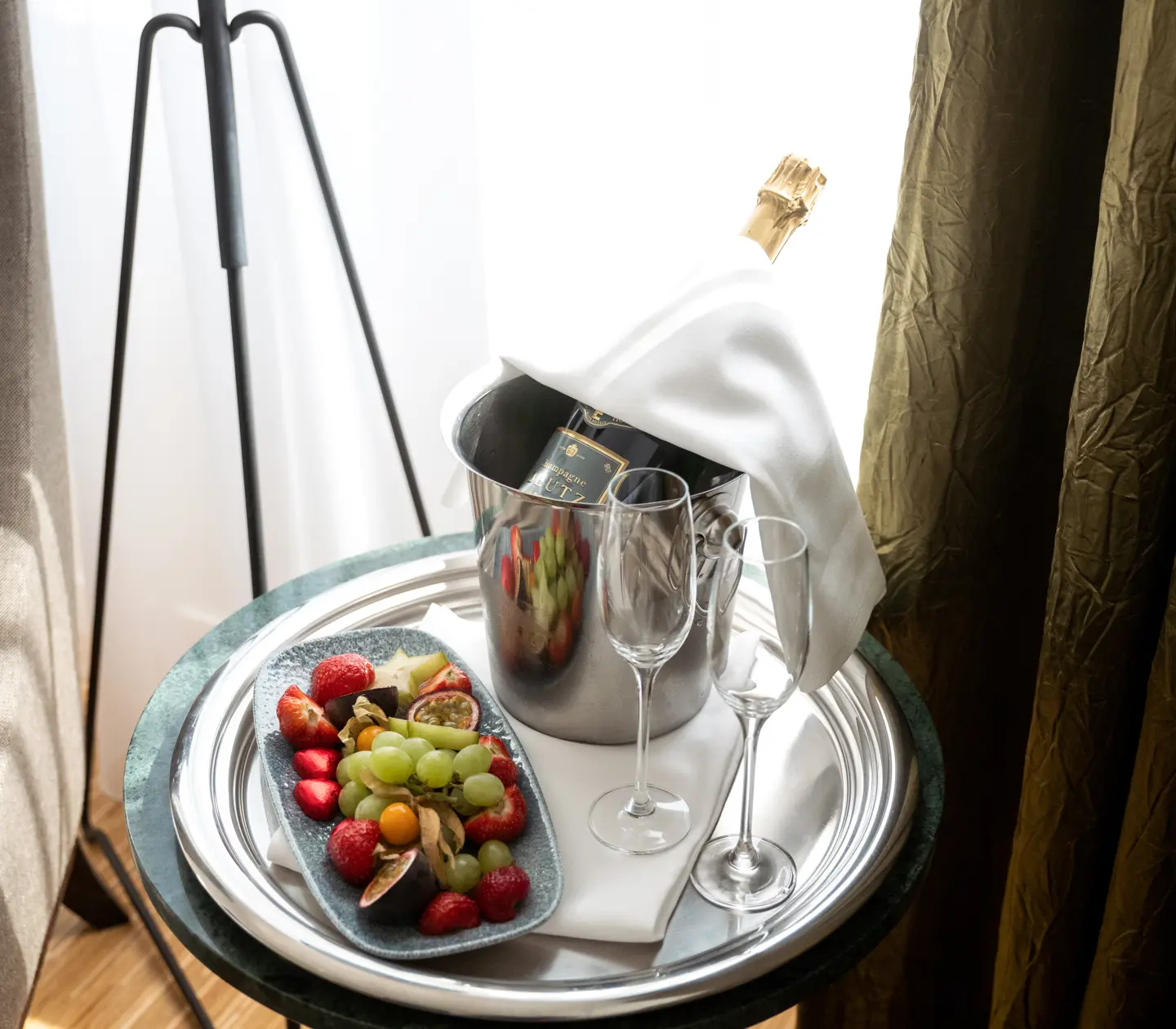 Vip with champagne, fruit and glasses laid out on the table