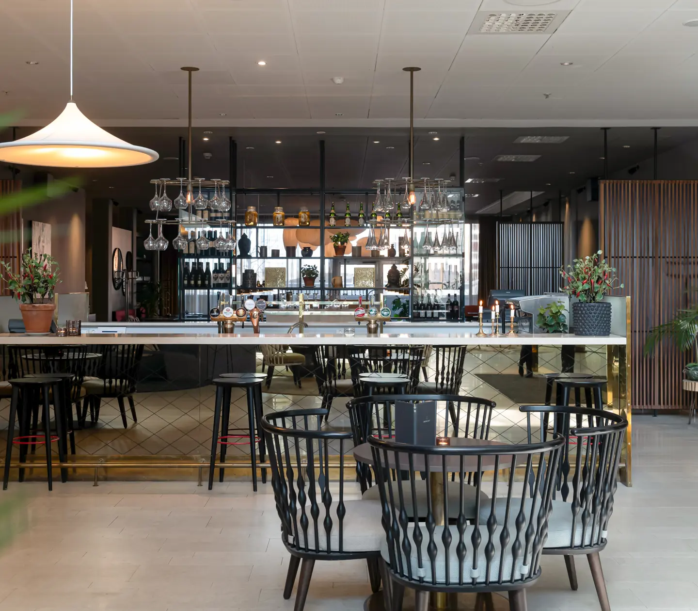 Bar with glasses, bottles and seating