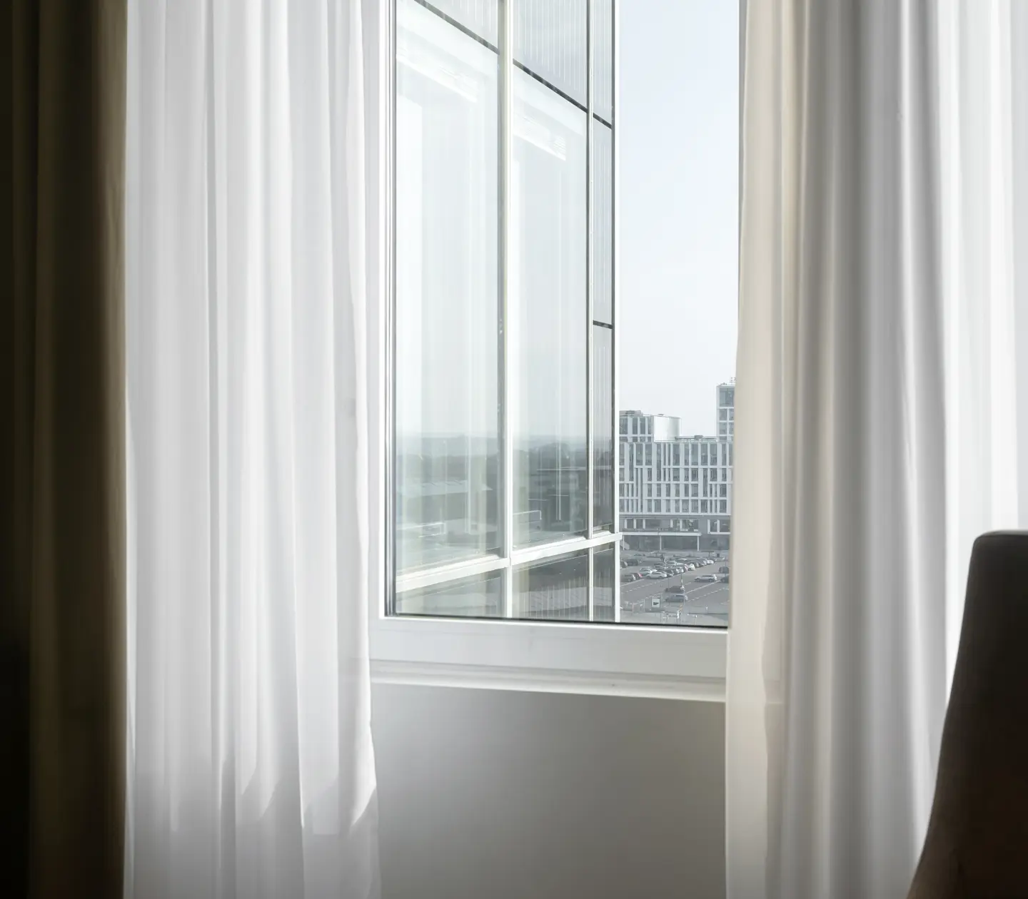 Window with curtains and view of Lund