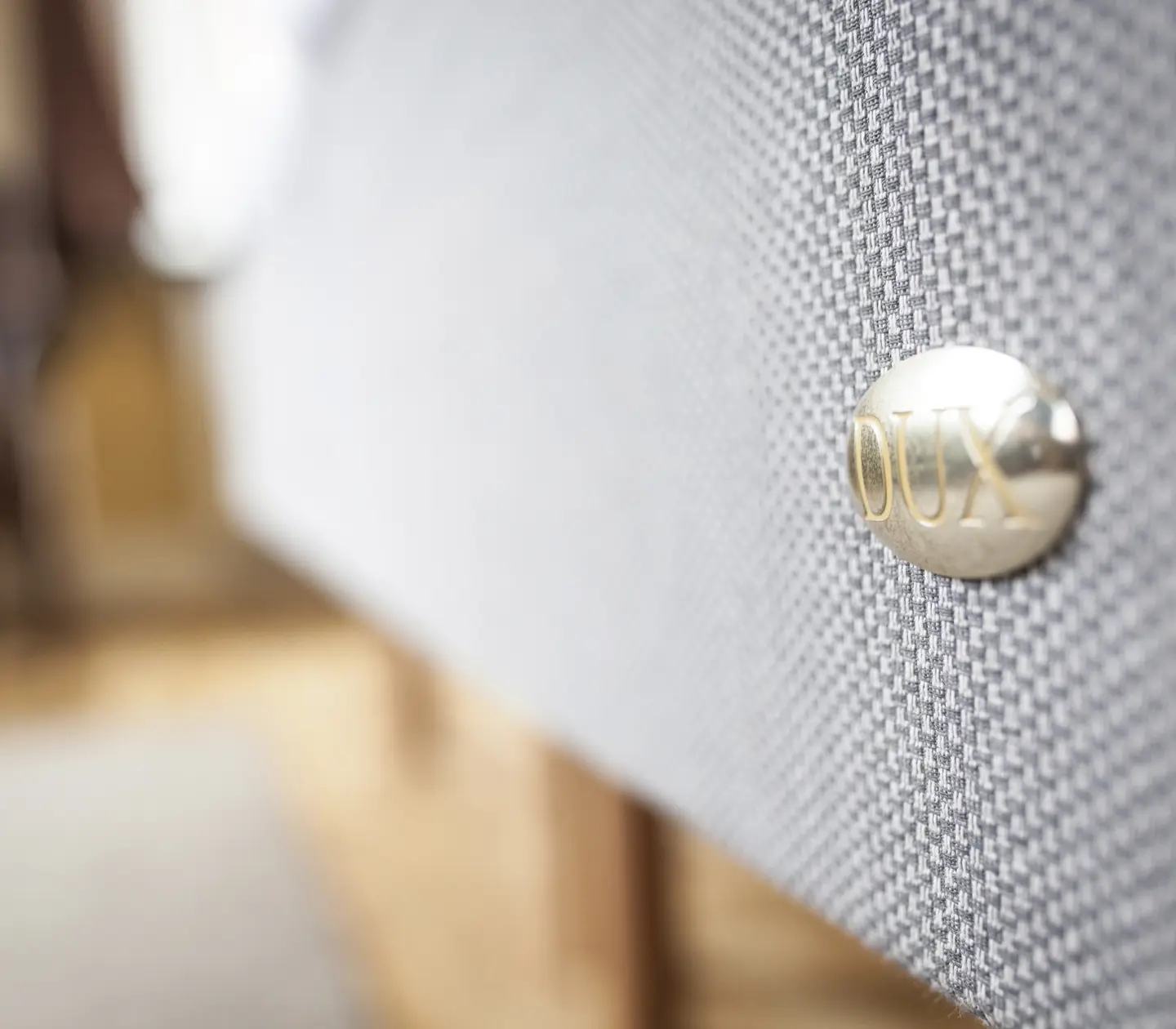 Close-up of bed and DUX brand
