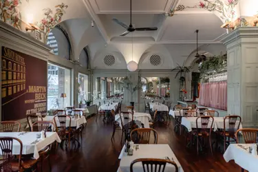 Dining room with high ceiling and cozy interior