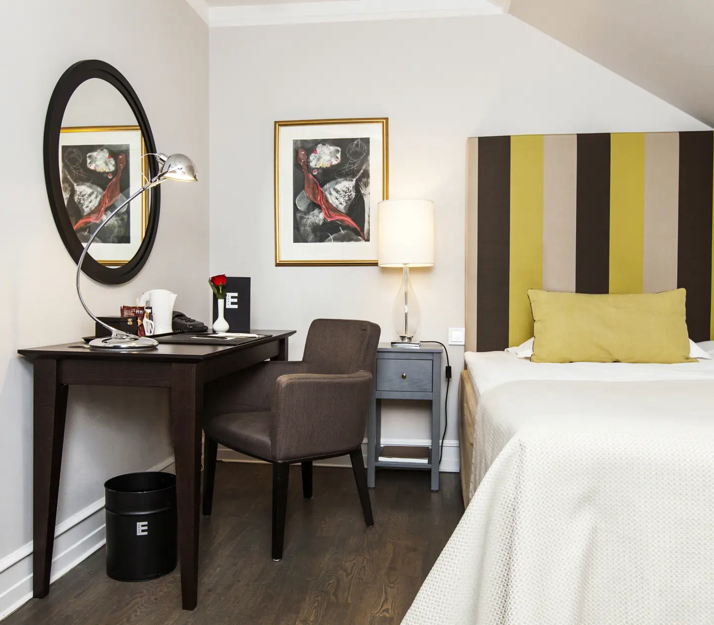 Hotel room with single bed, desk and mirror