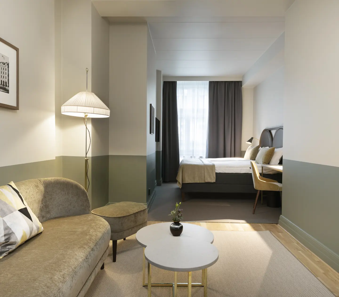 Hotel room with double bed, sofa and TV