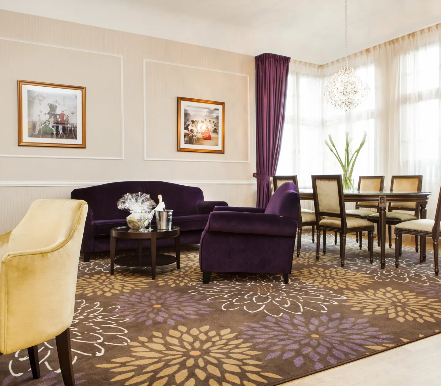Suite with desk, sofa group and dining area