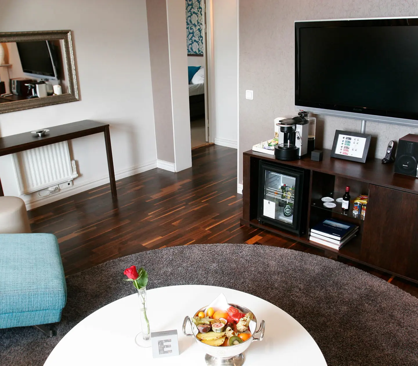 Suite with TV, sofa group and mirror