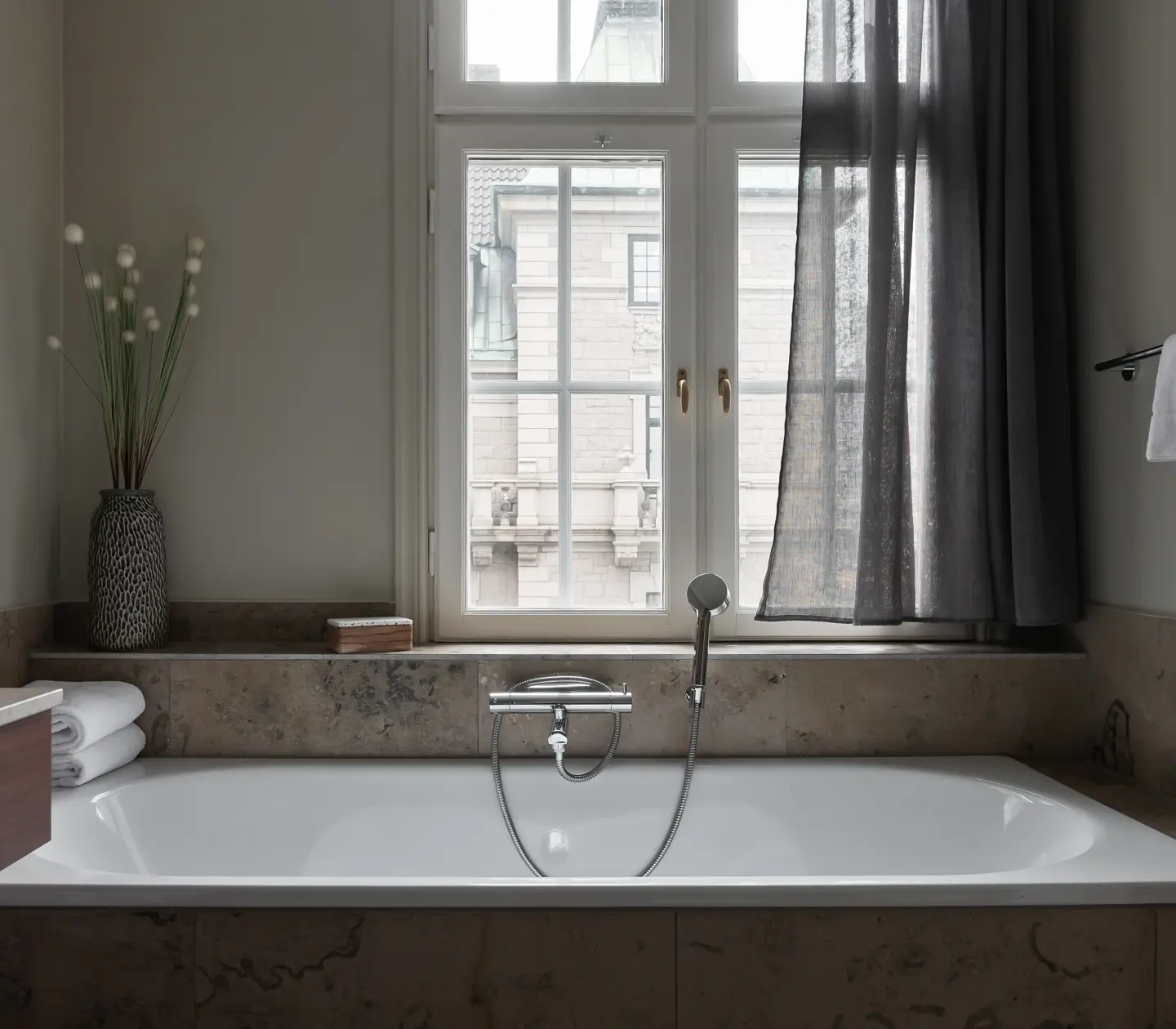 Bathroom with bathtub and window