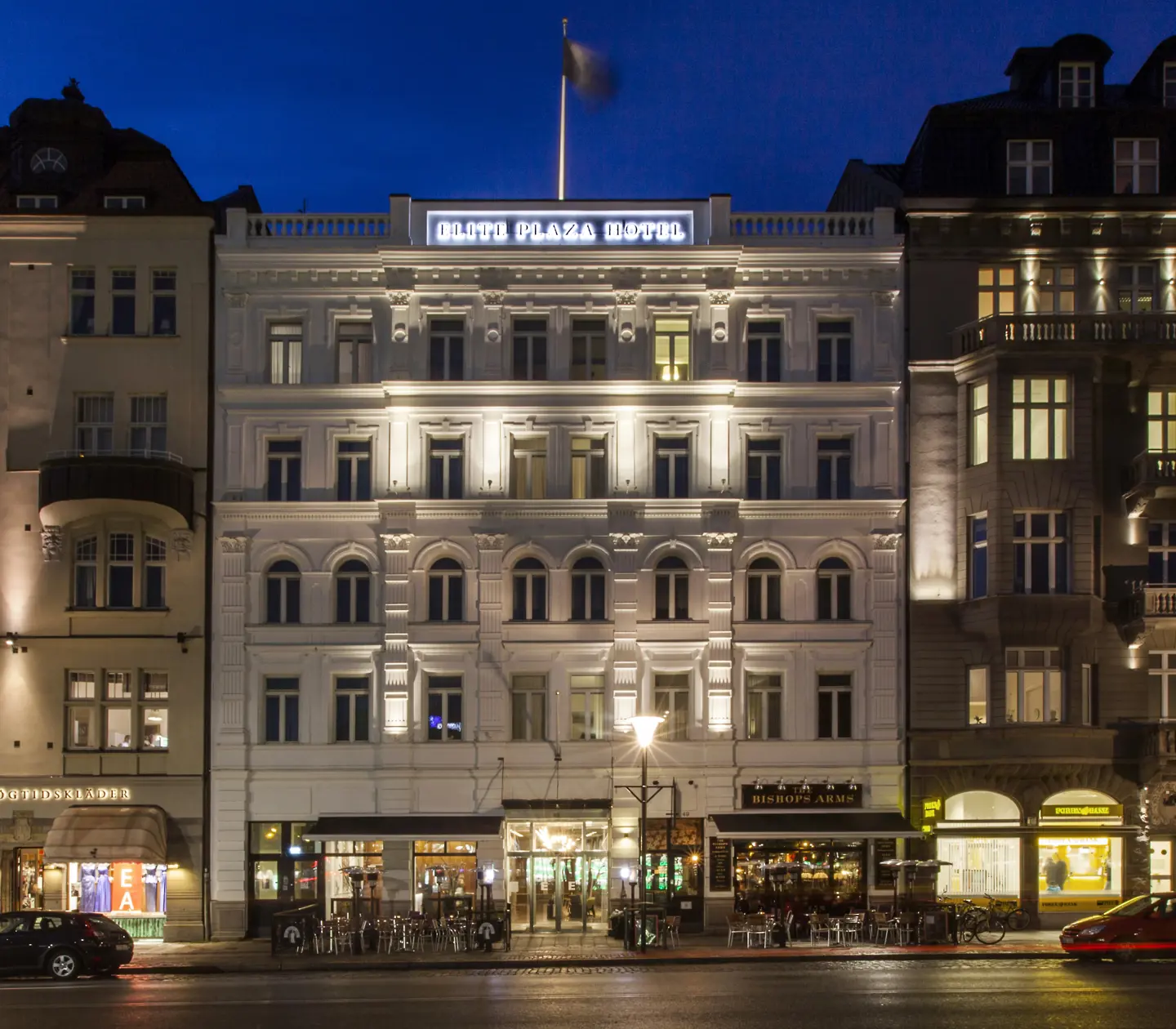 The white facade of the Elite Plaza Hotel in Malmö at dusk