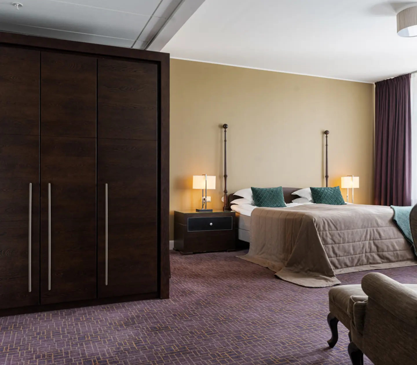 Cozy suite with sofa group, armchairs and window