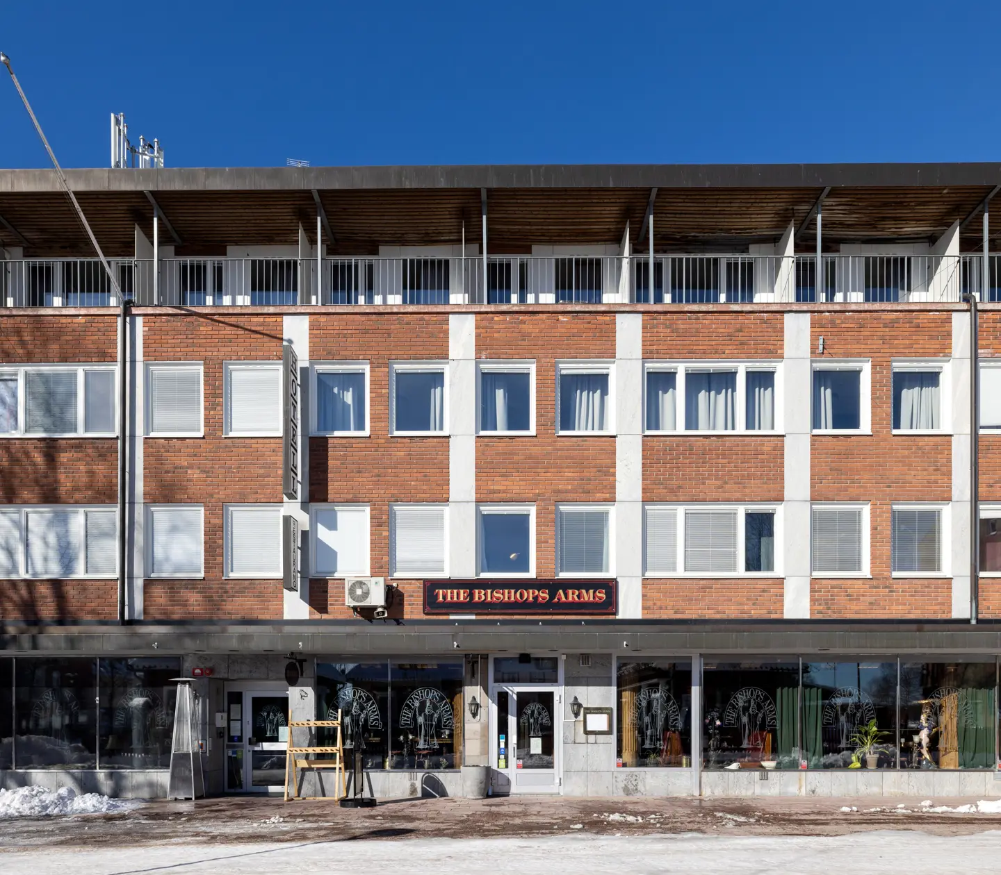 Facade of Hotel Bishops Arms with street in front