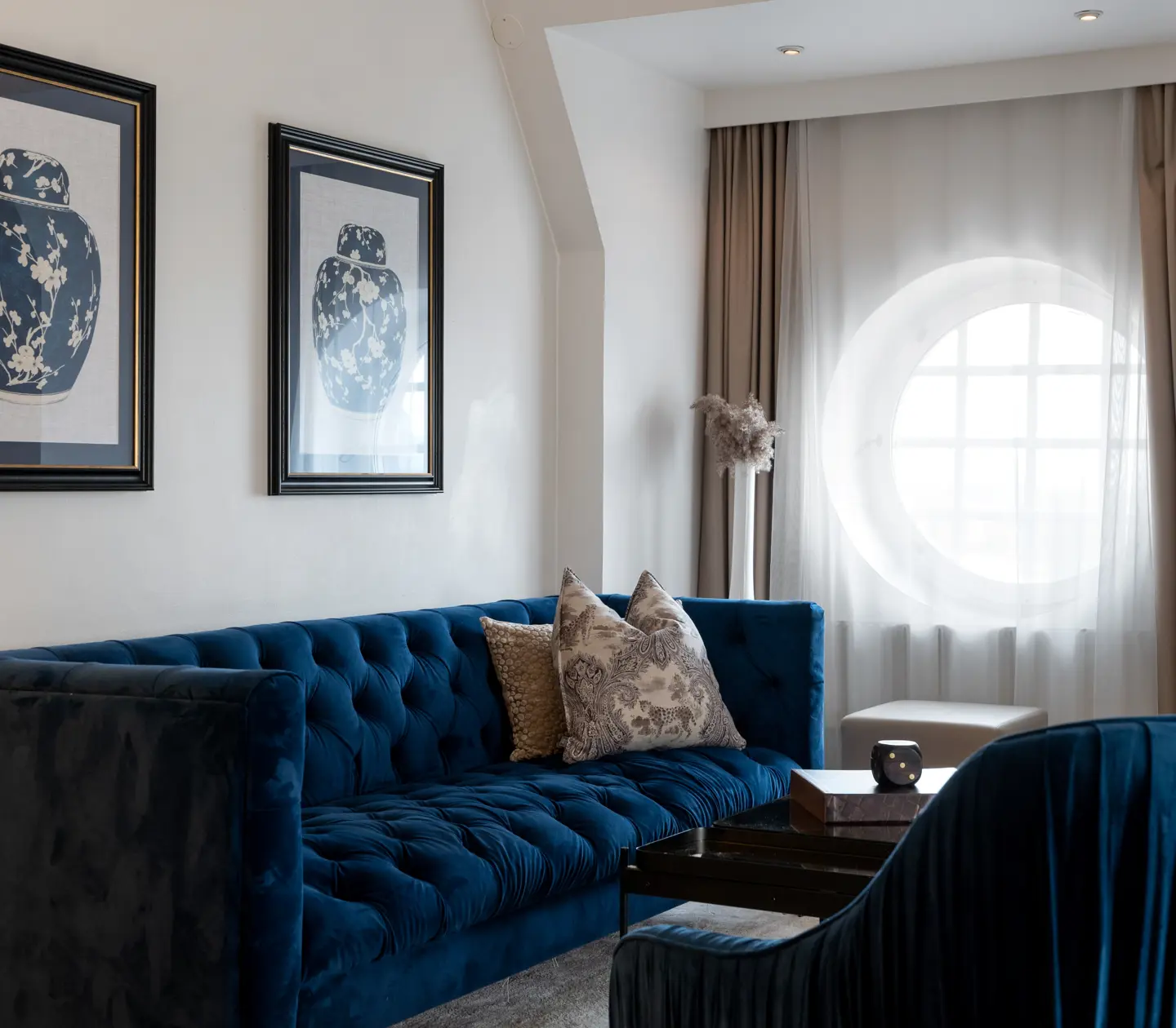 Hotel group with sofa group, around windows and paintings
