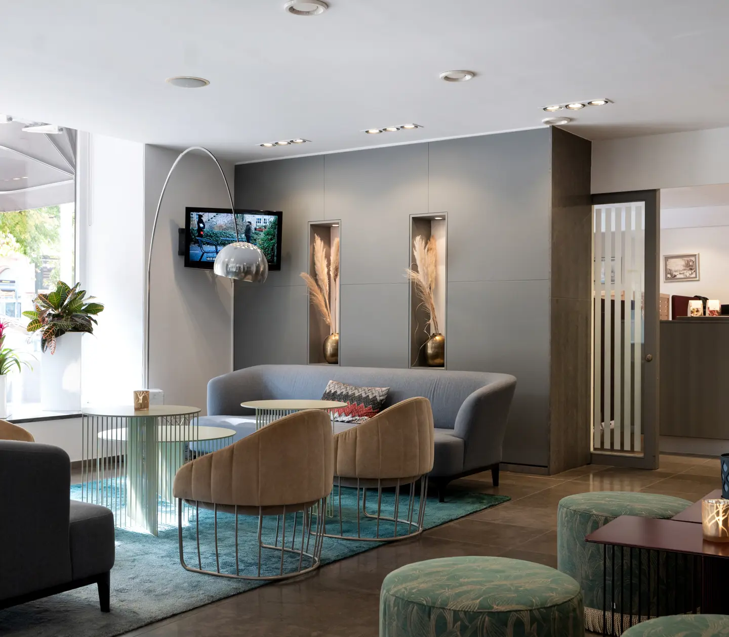 Hotel lobby with reception desk and lounge furniture