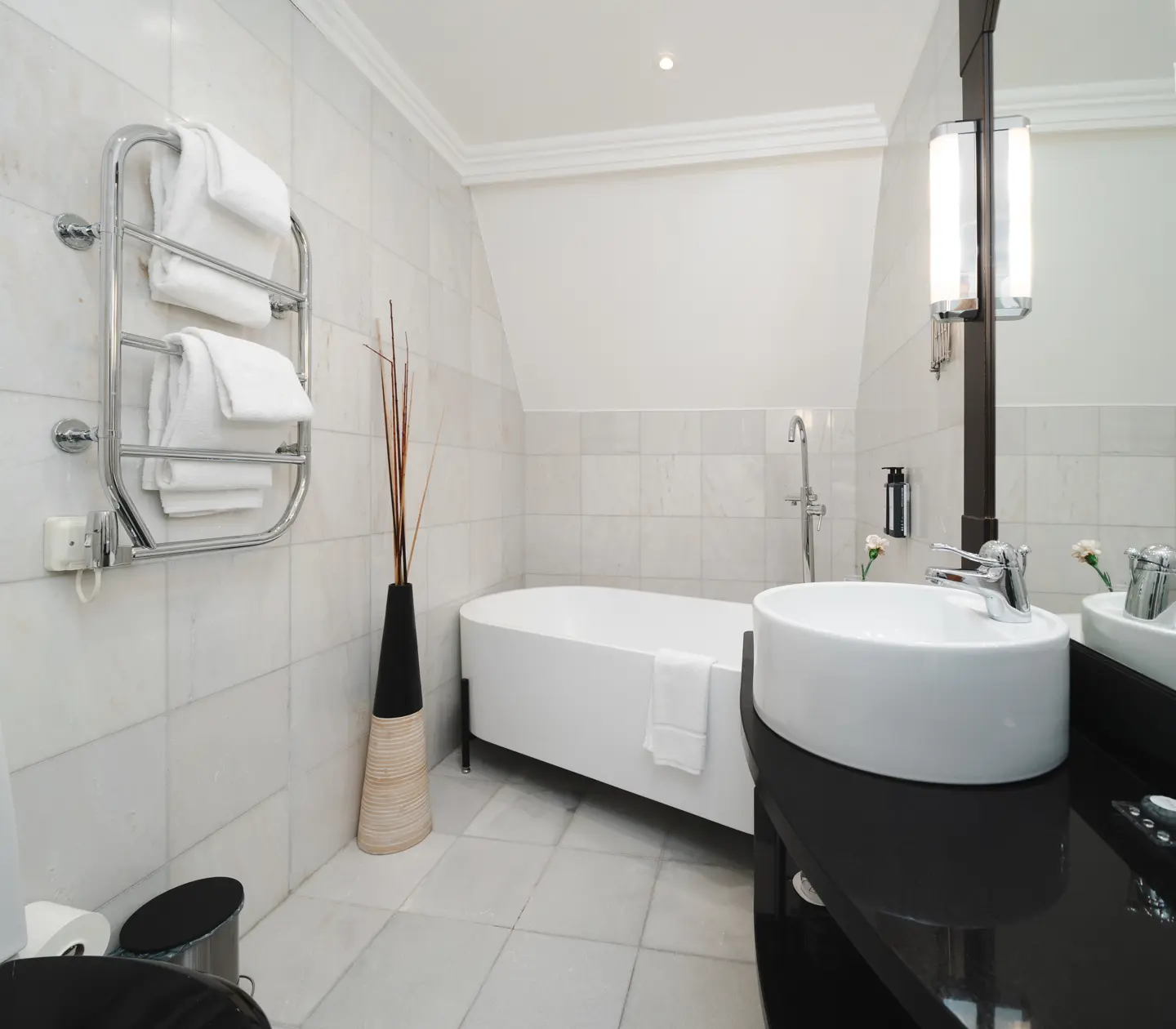 Bright bathroom with toilet, bathtub and sink
