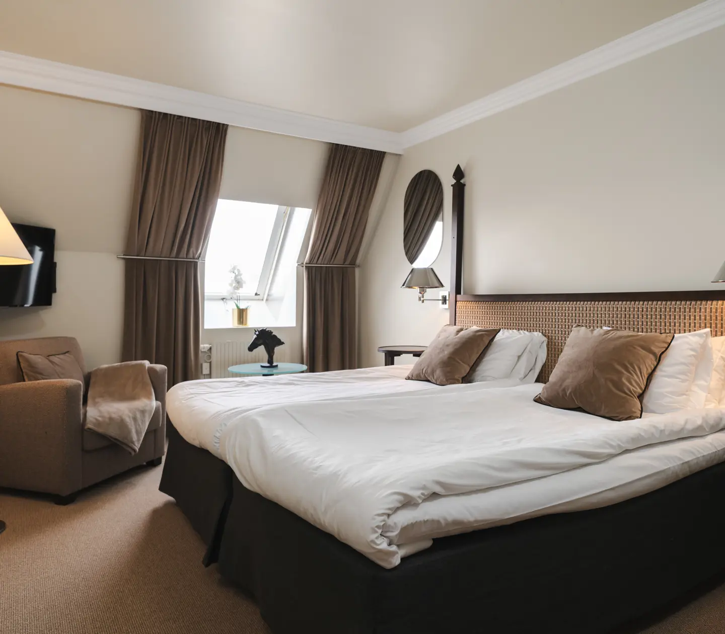 Suite with bed, armchair and window