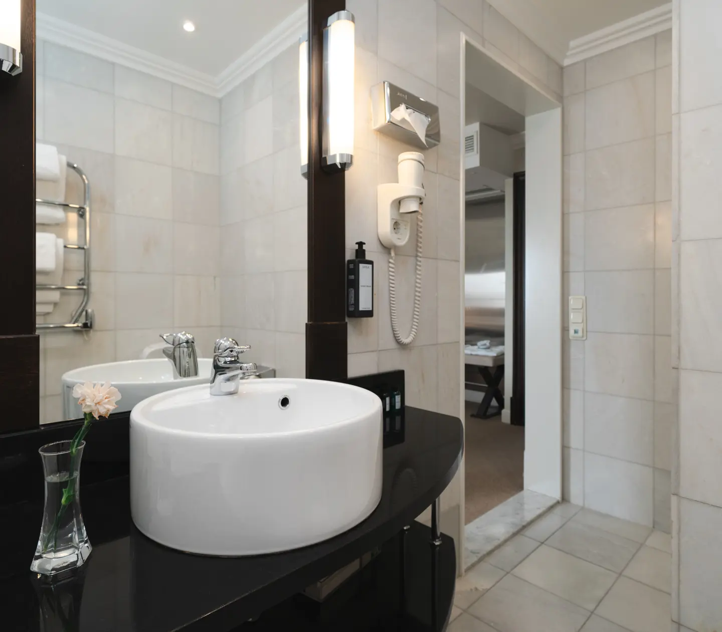Bright bathroom with round sink and mirror