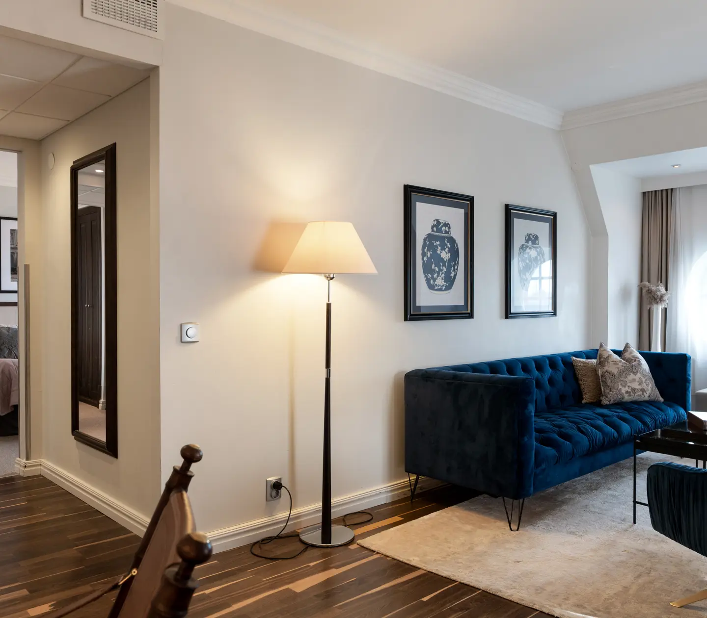 Cozy suite with sofa group, bed and window