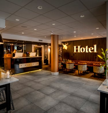 Hotel lobby with reception desk and lounge