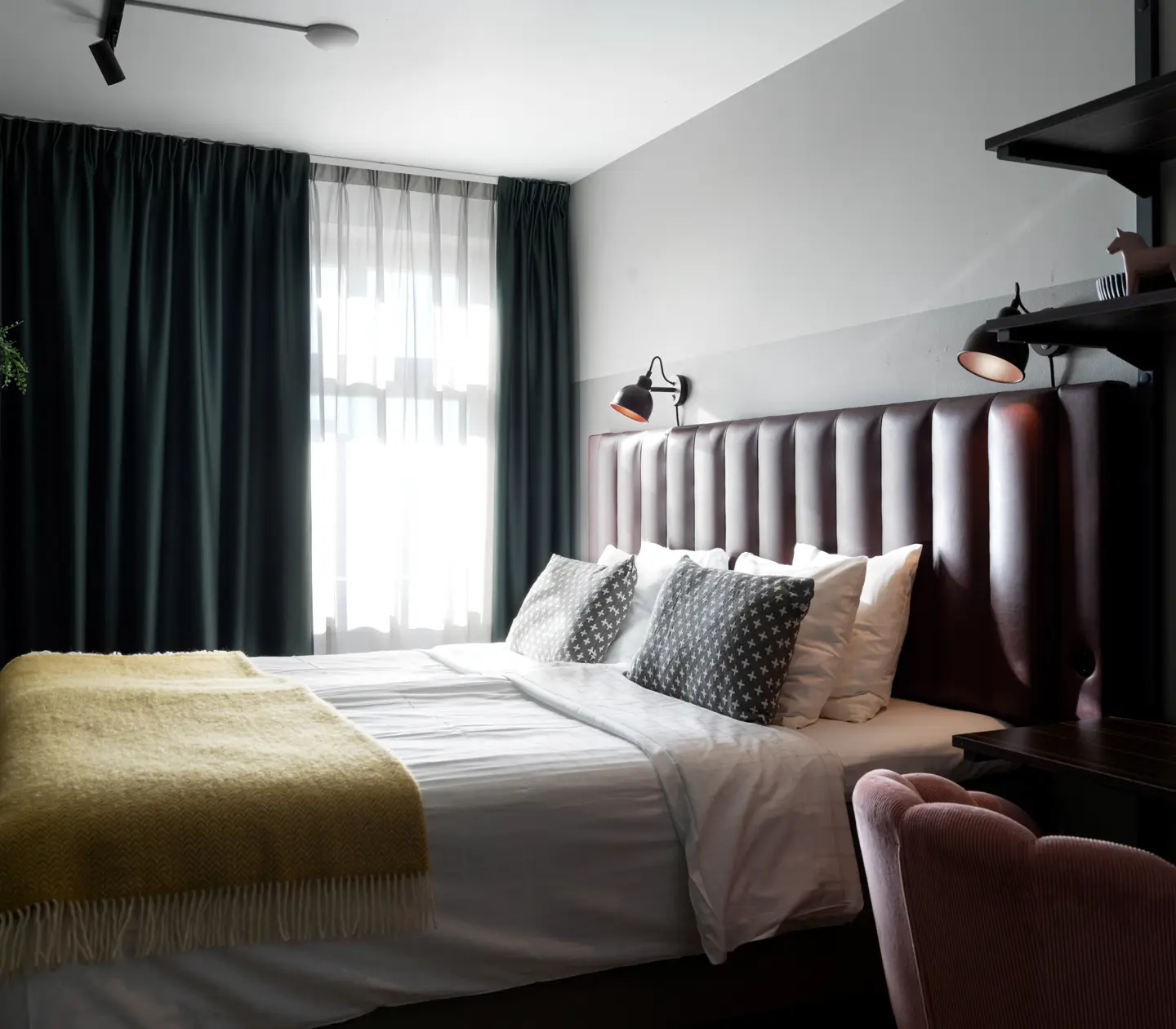 Hotel room with desk, double bed and window