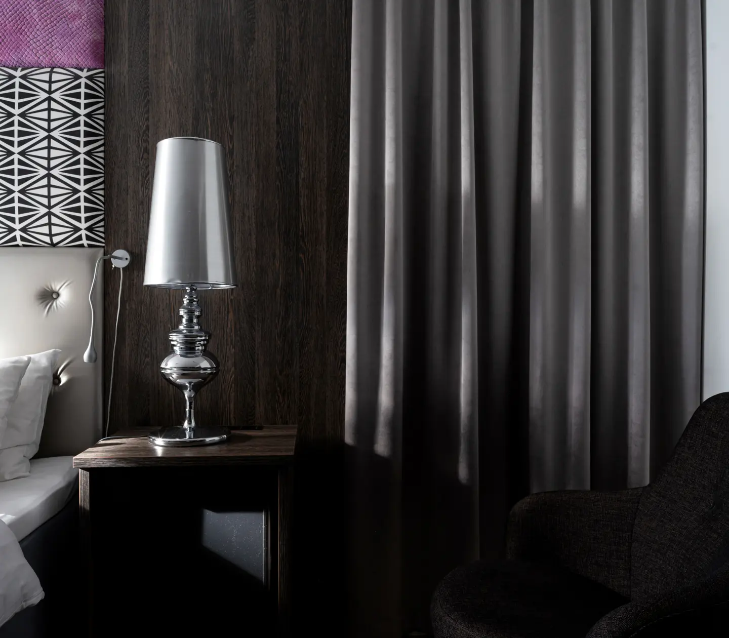 Close-up of with double bed, armchair and lamp