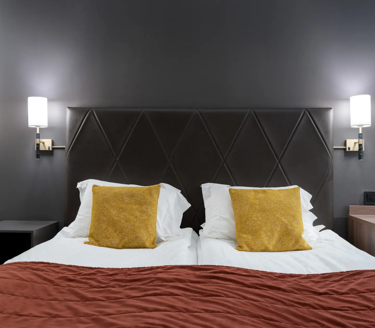 Hotel room with double bed and desk
