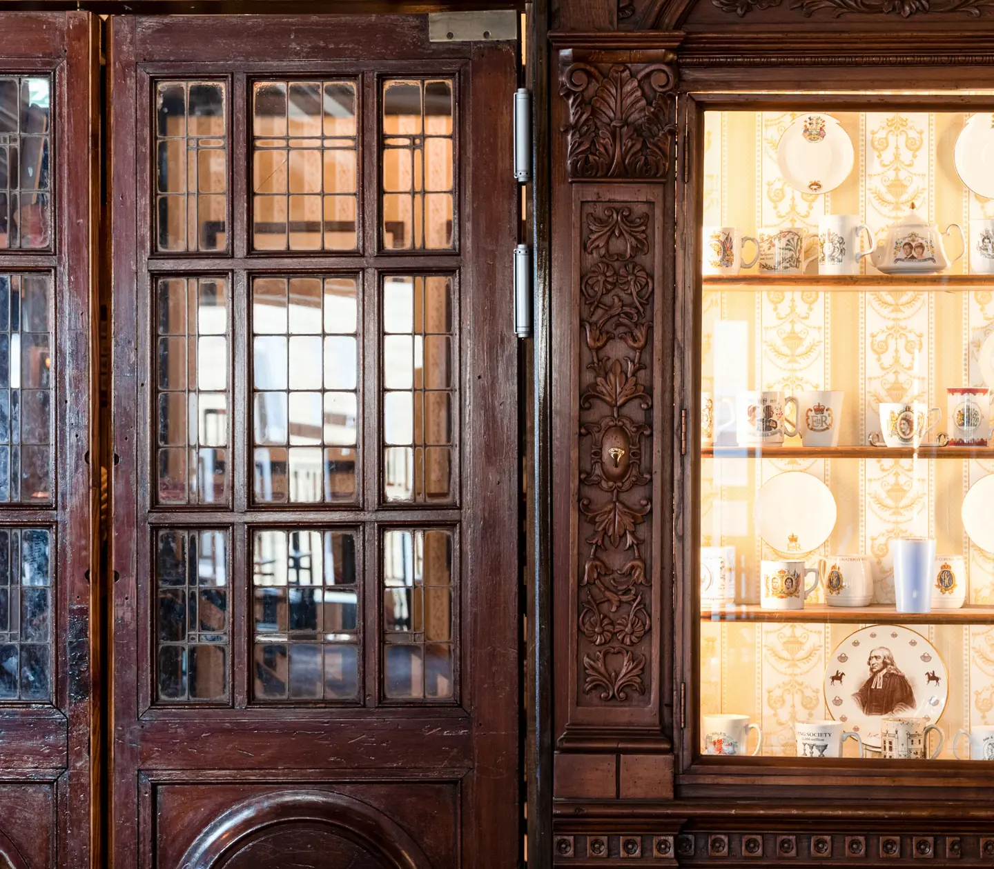 Pub environment with glass doors and china in glass cabinets