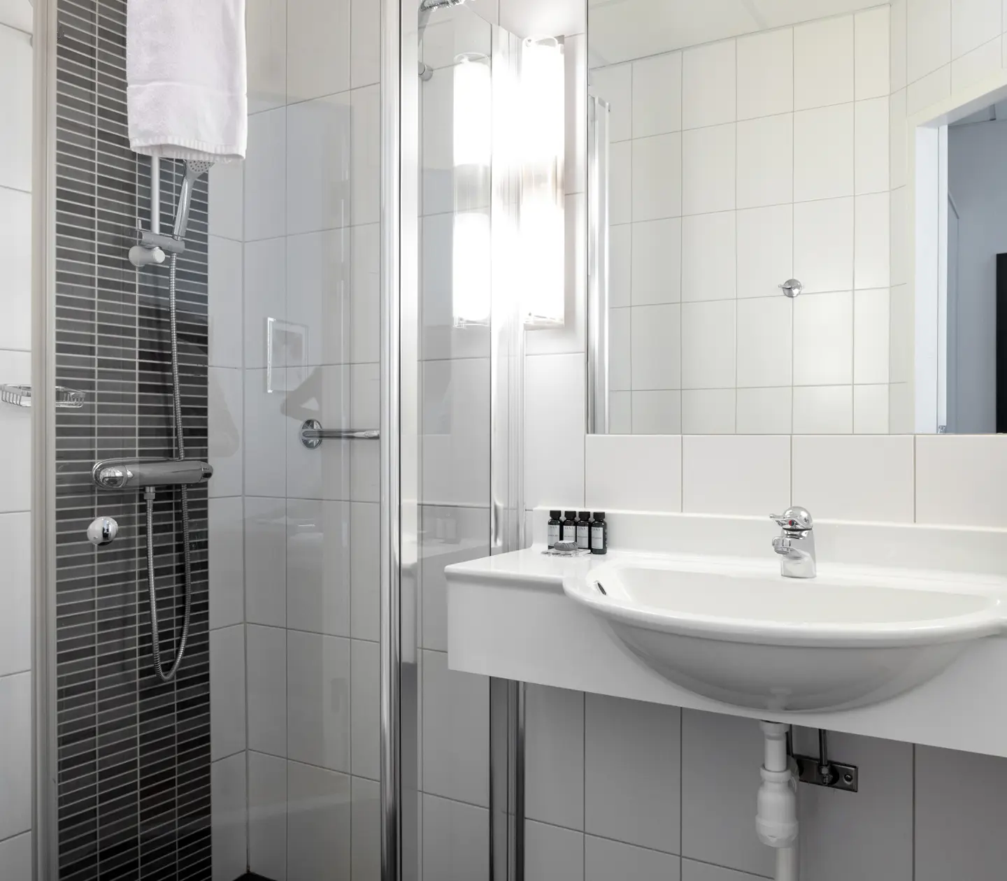 Bright bathroom with shower and sink