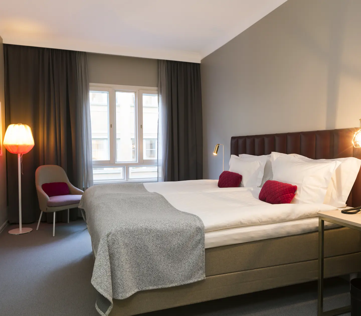 Beautiful room with double bed and armchair