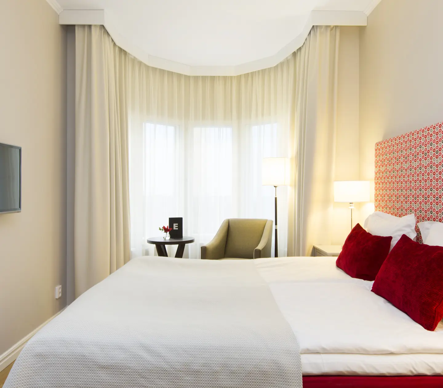 Beautiful room with double bed, armchair and large window