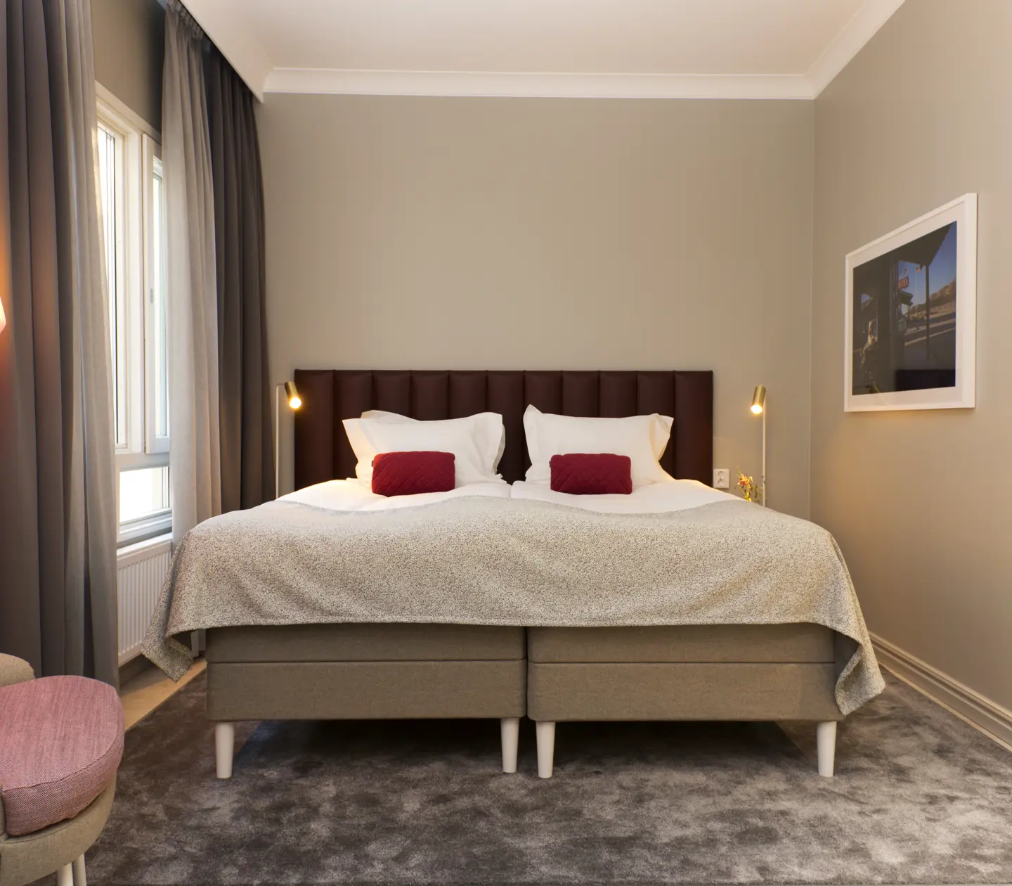 Room with double bed and armchair