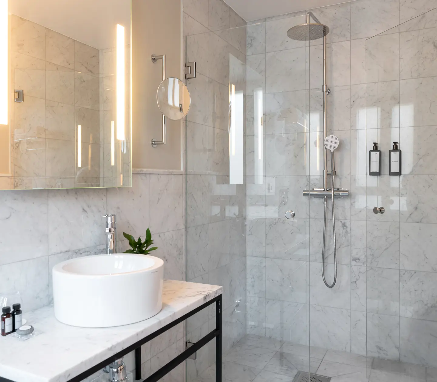 Marble bathroom with shower and sink
