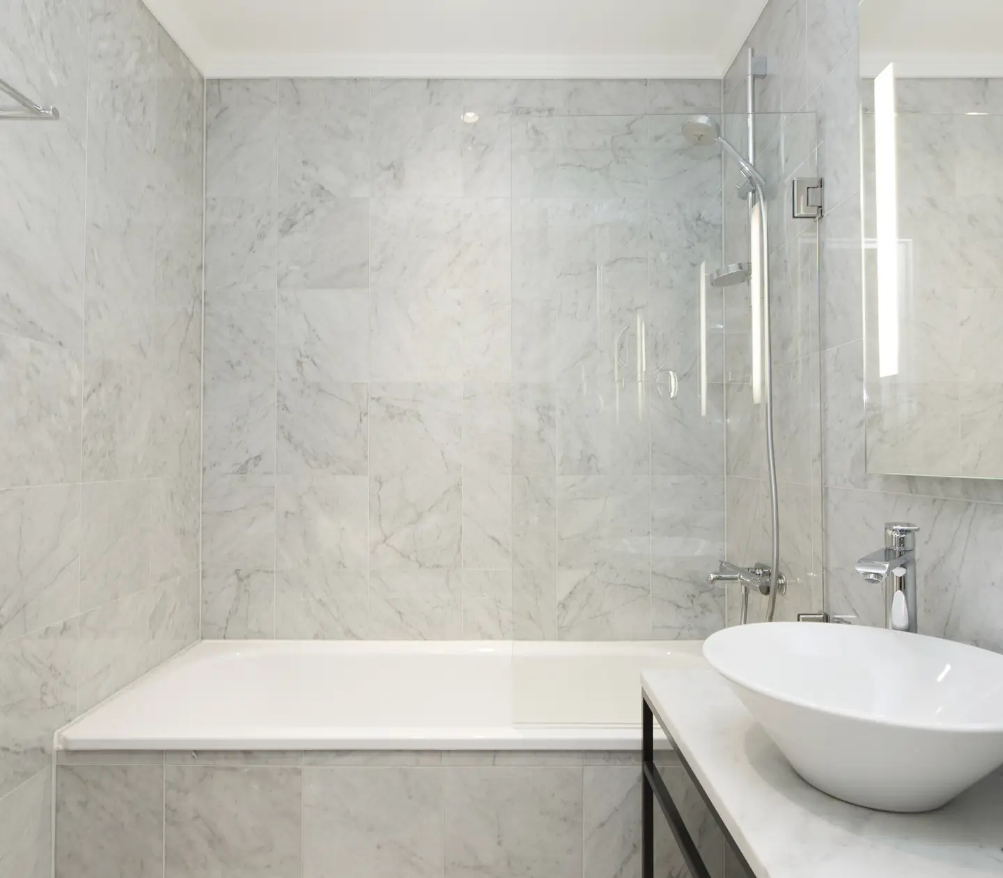 Marble bathroom with bathtub and sink