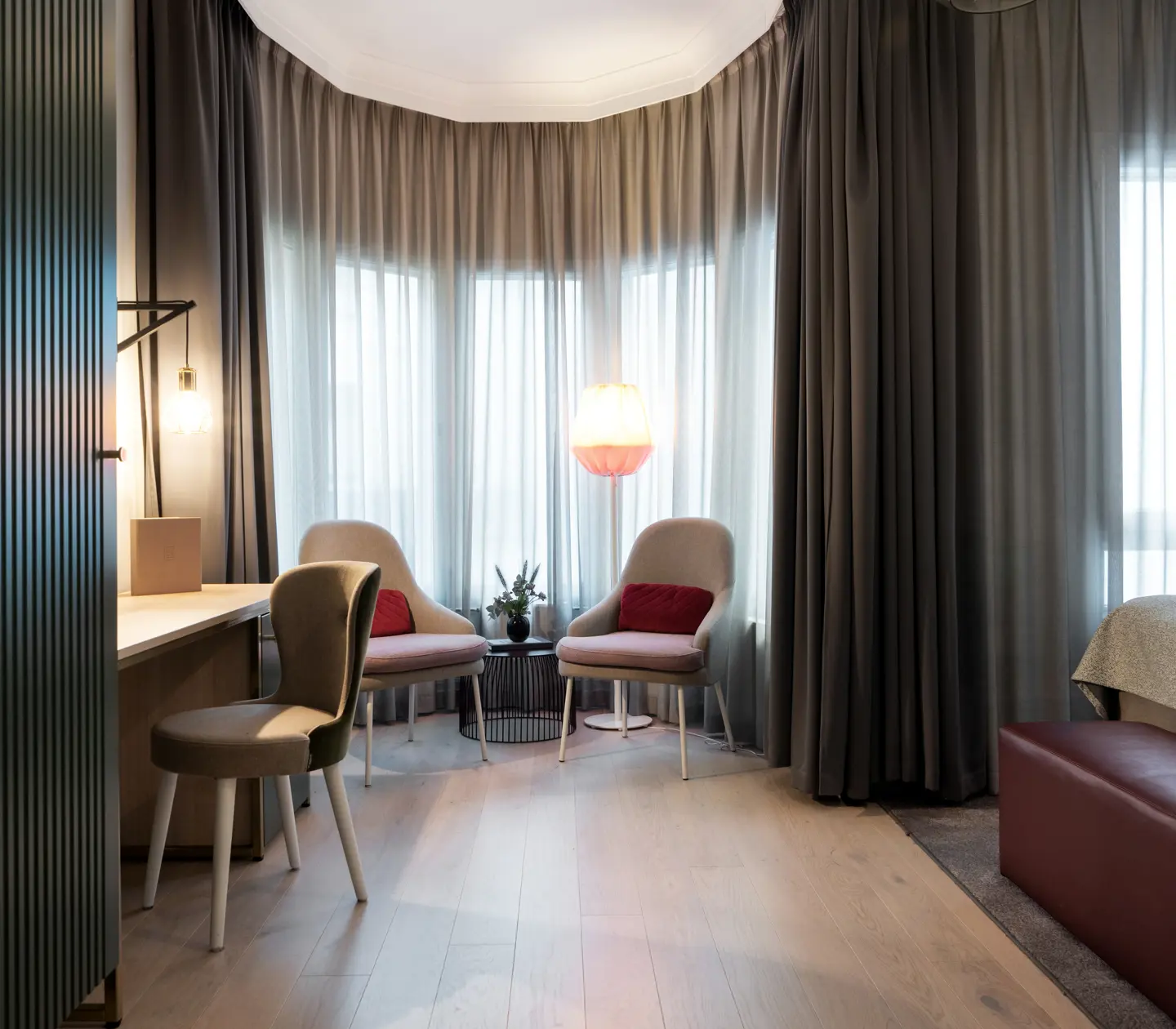 Beautiful room with natural light, seating area, desk and bed