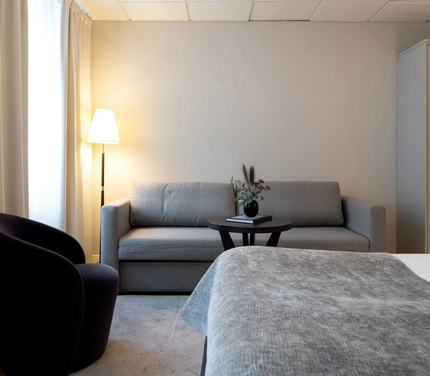 Room with bed, sofa and armchair