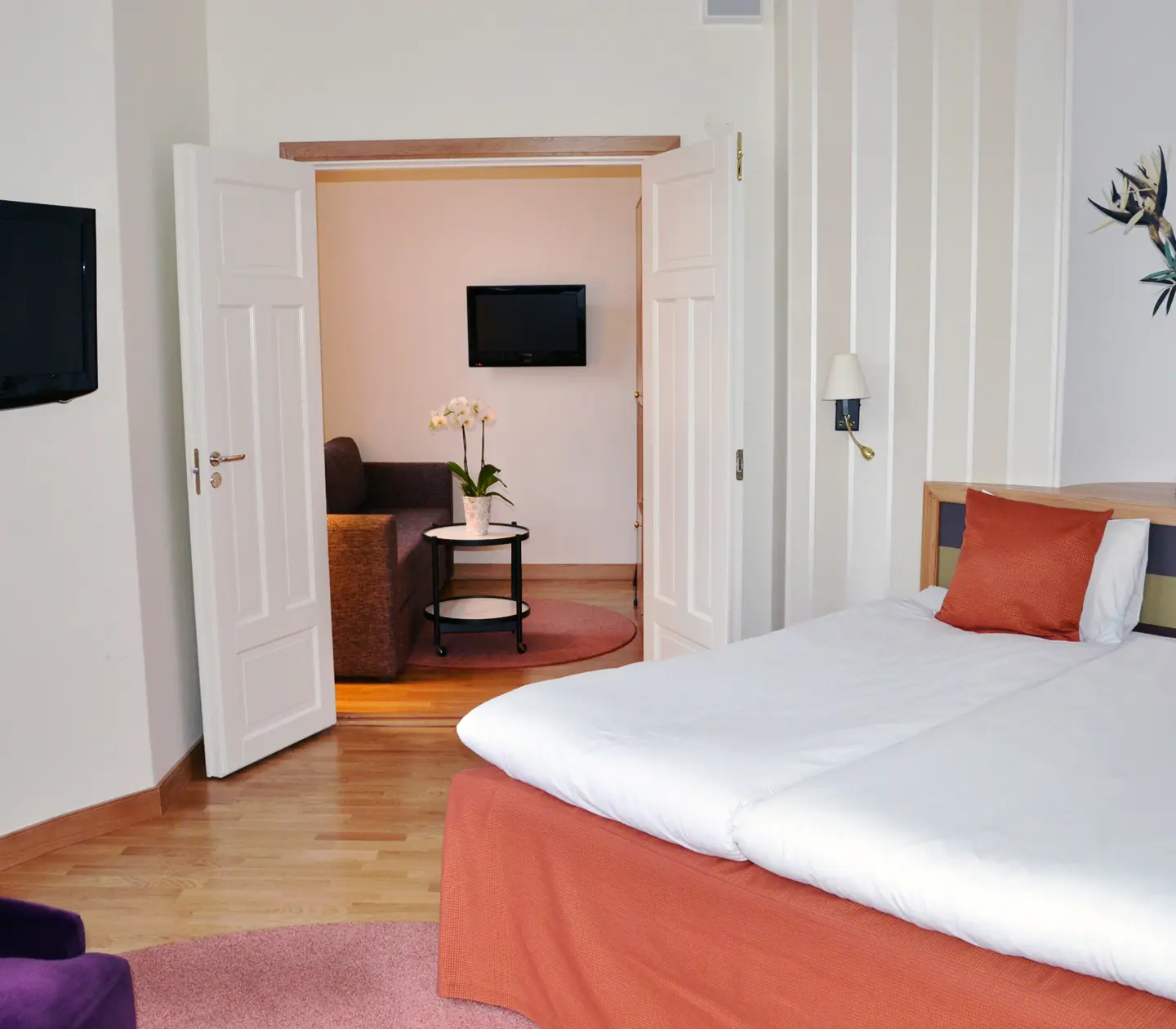 Beautifully furnished bedroom with adjoining living room