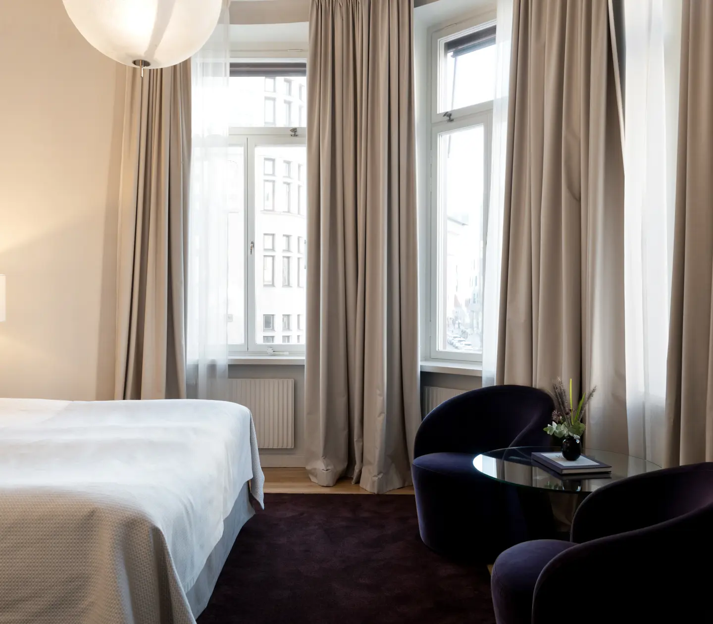 Room with beautiful light and bed and seating area