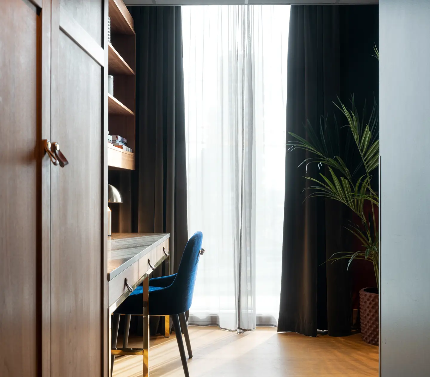 Cozy suite with wardrobe, desk and window
