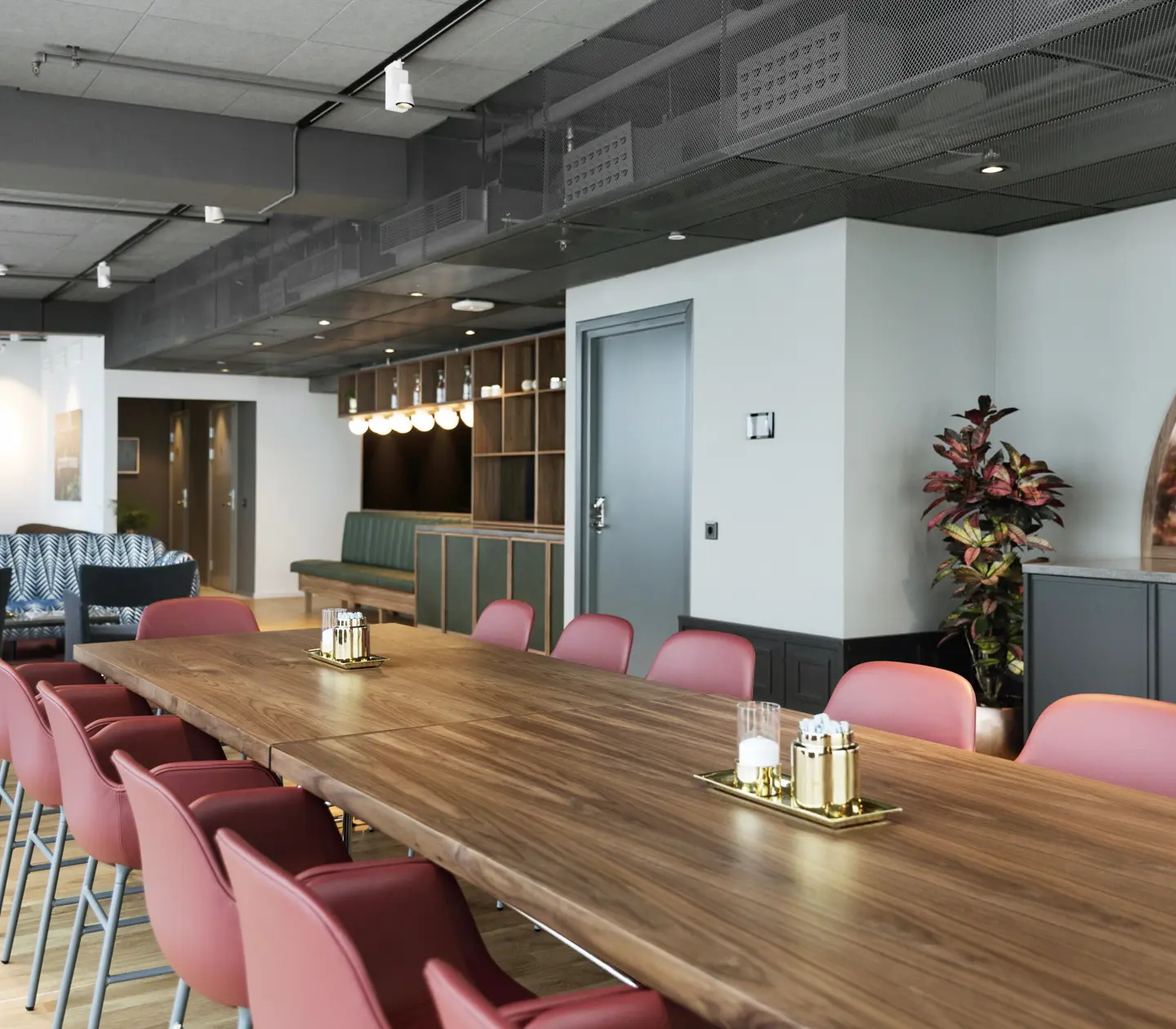Conference room with large table, chairs and plants