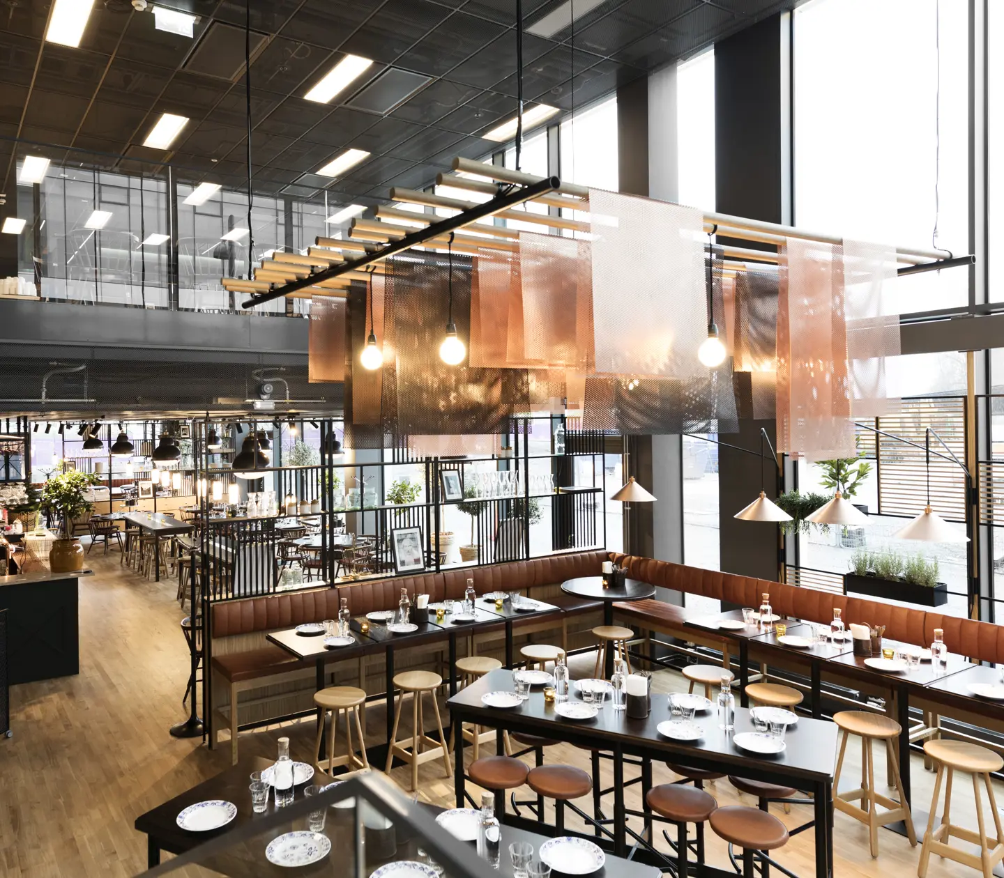Dining room with bar, bar stools and ceiling lamp