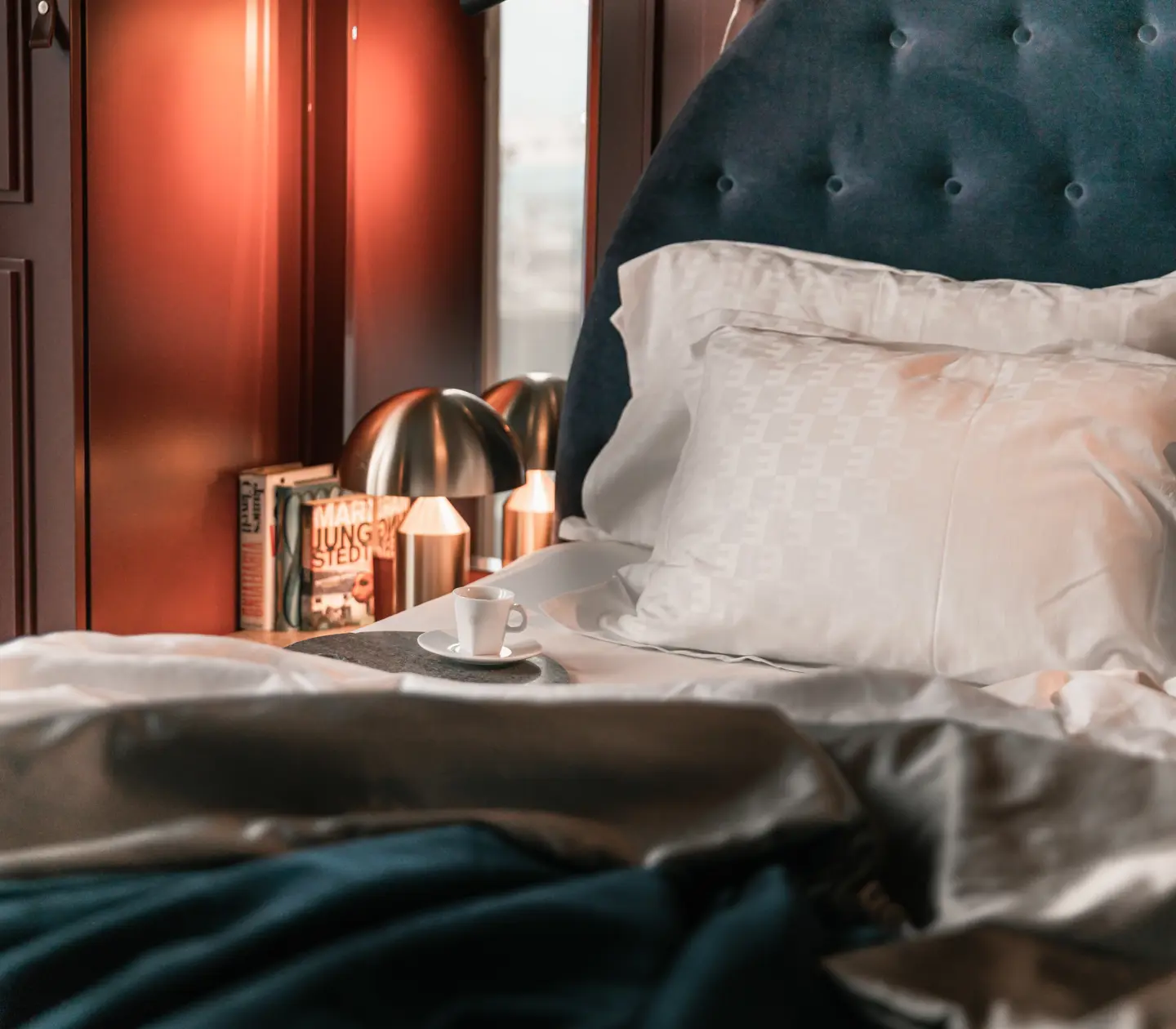 Hotel room with bed and coffee cup