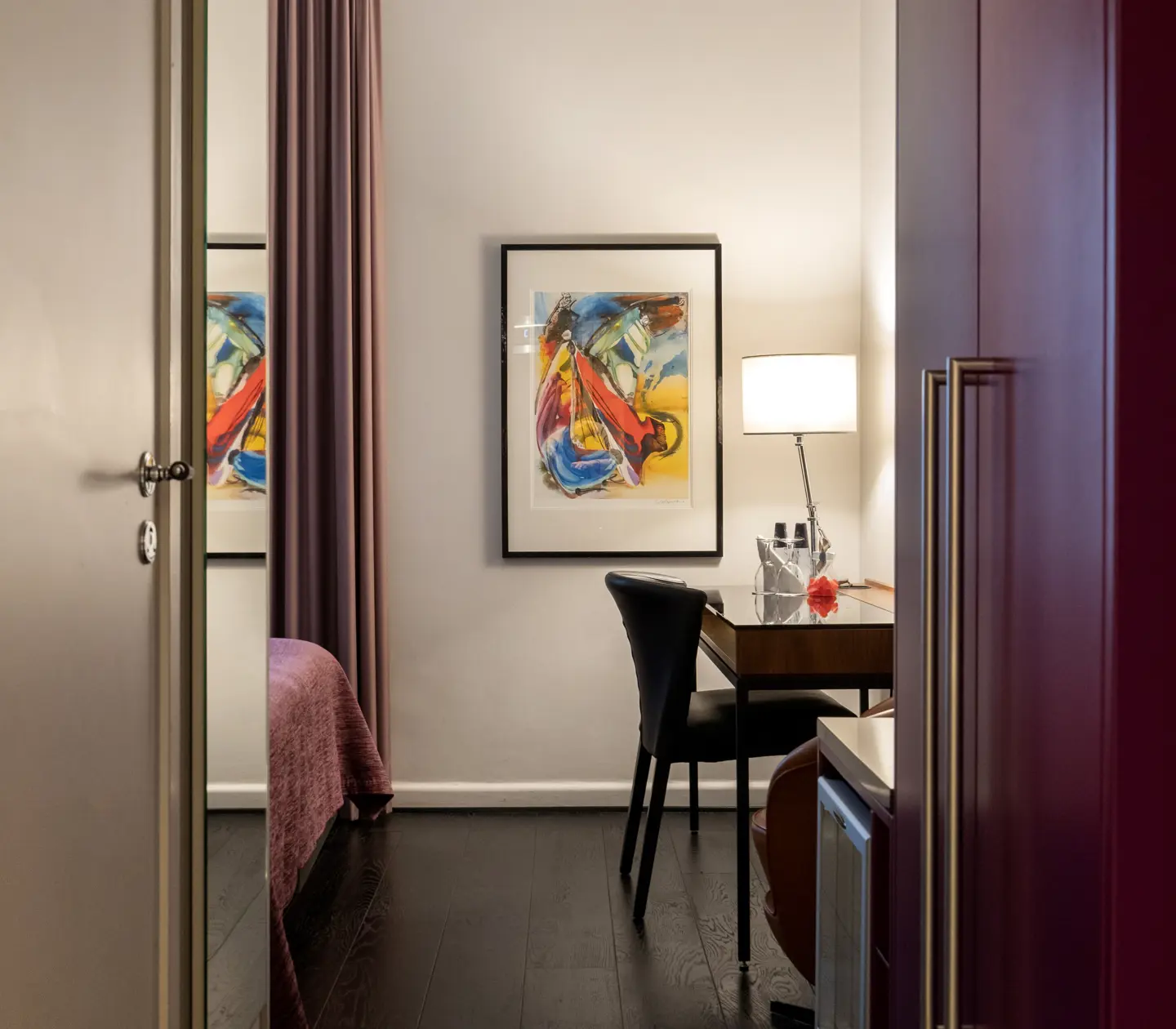 Hotel room with mirror, blackboard, wardrobe and desk