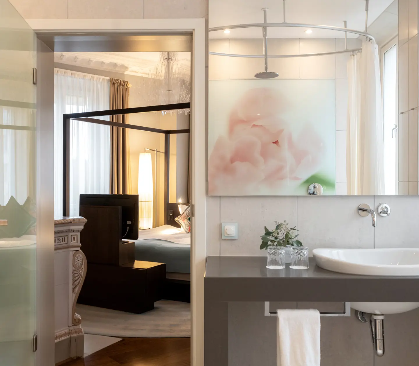 Bright bathroom with sink, mirror, blackboard and door to bedroom
