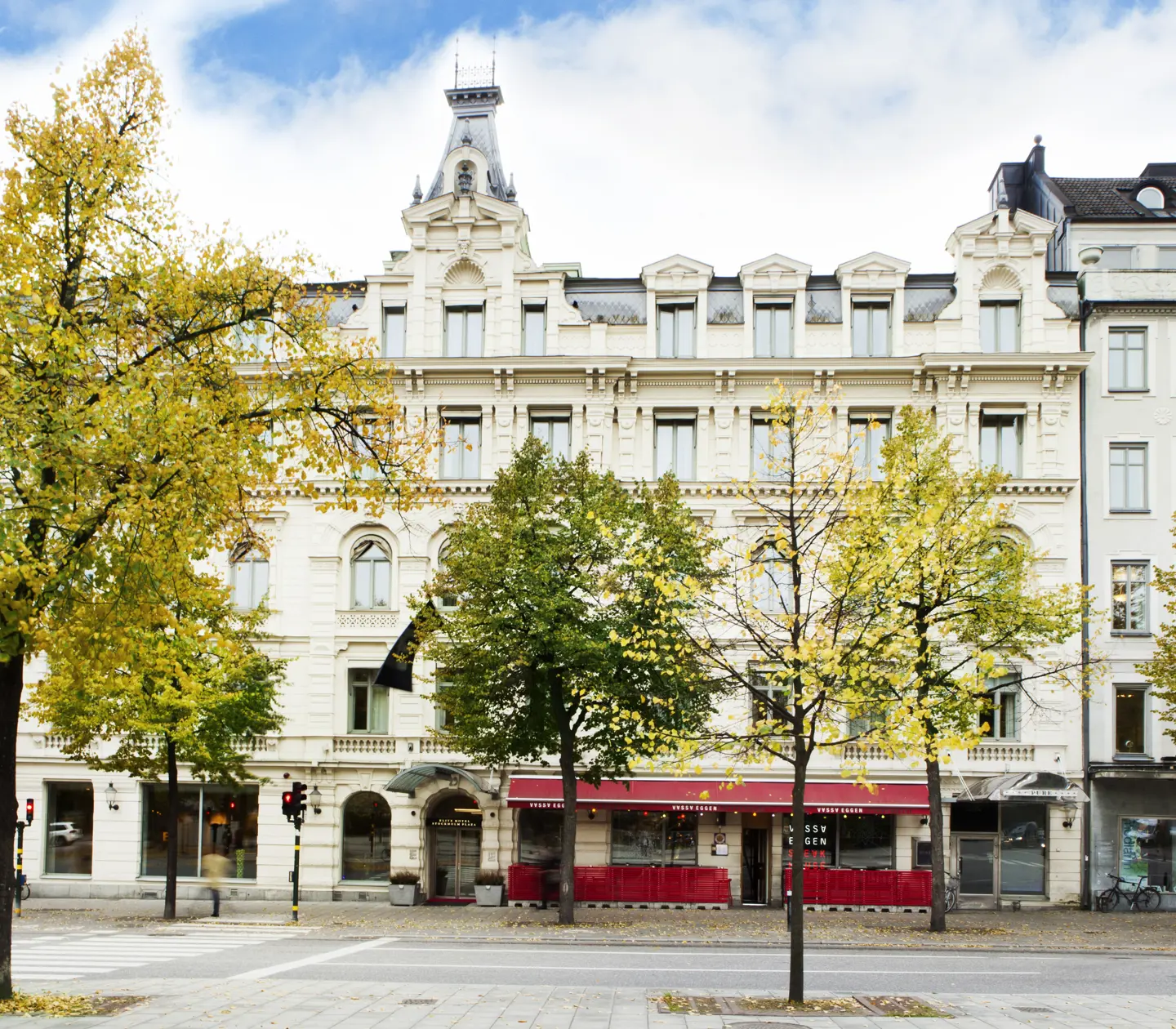 Elite Hotel Stockholm Plaza's facade with verdant trees outside