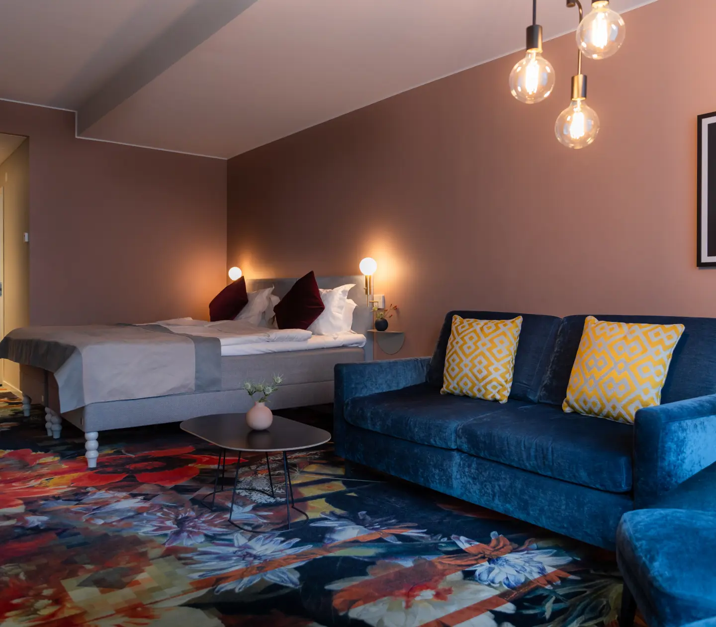 Bed and sofas in blue fabric