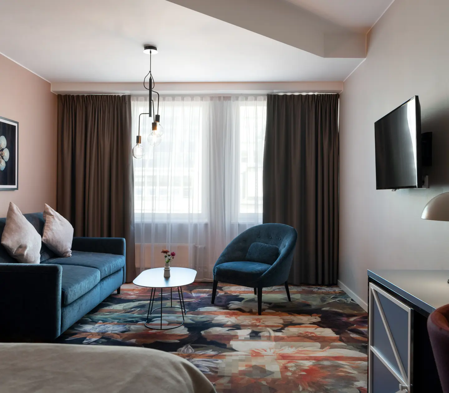 Sofa, armchair and TV on the wall