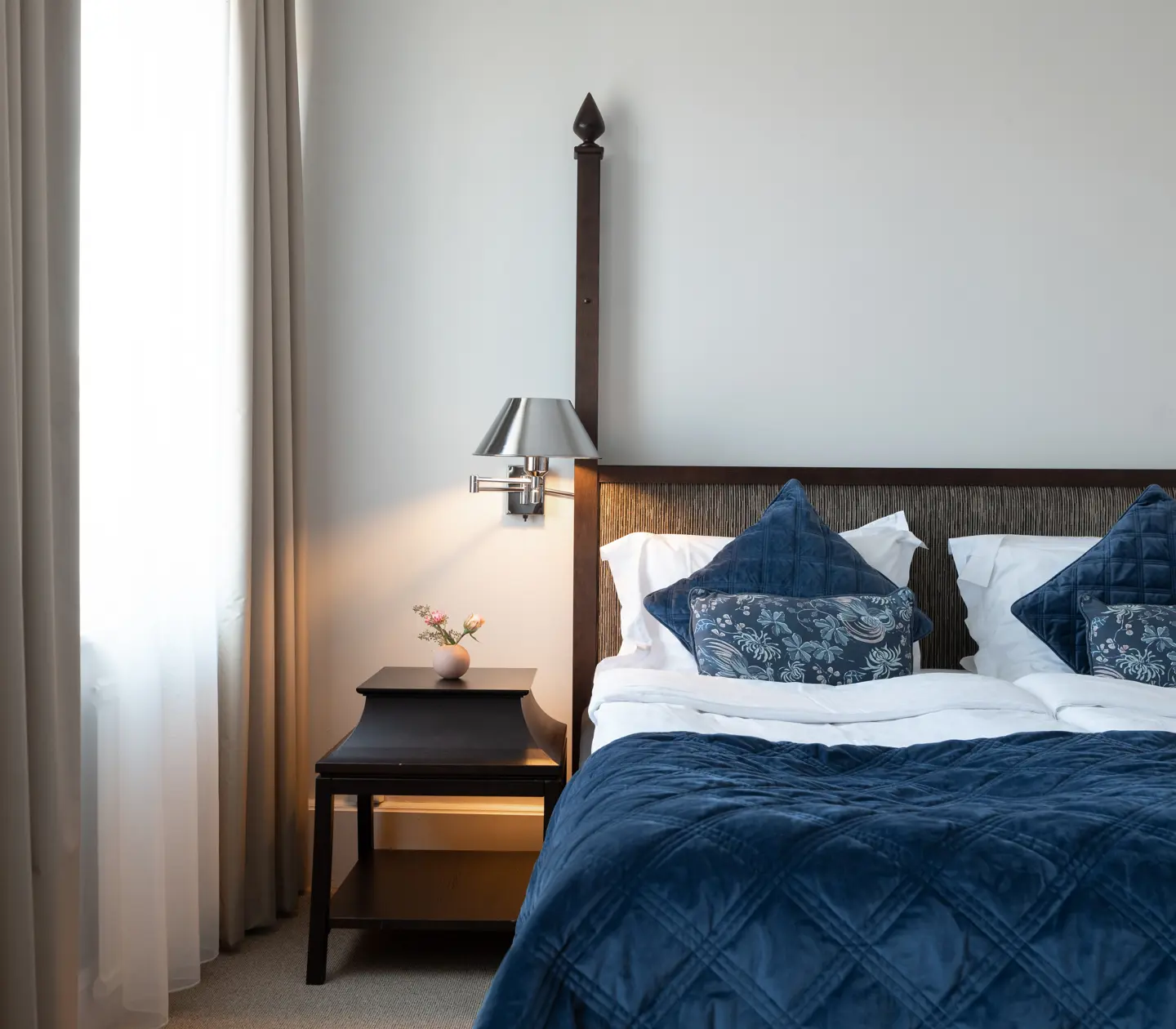 Bed with wooden headboard