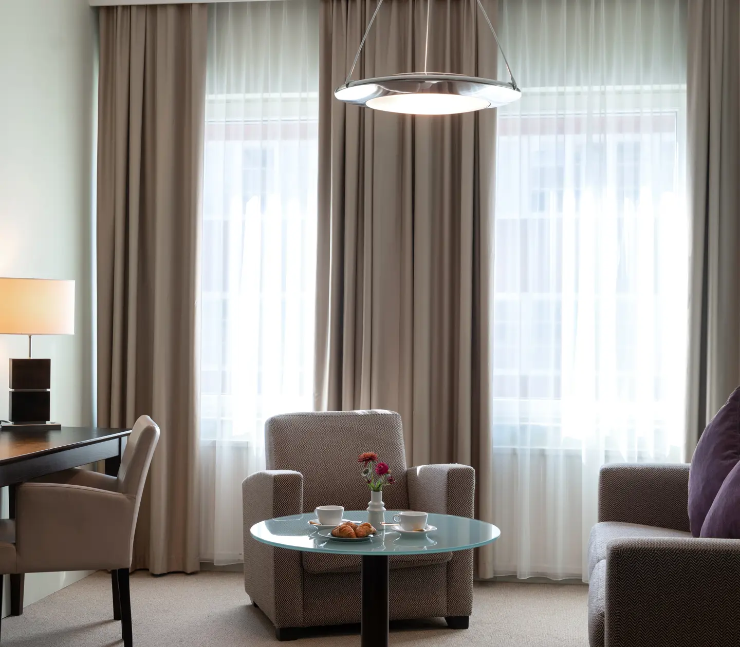 Lounge area with sofas, desk and armchair