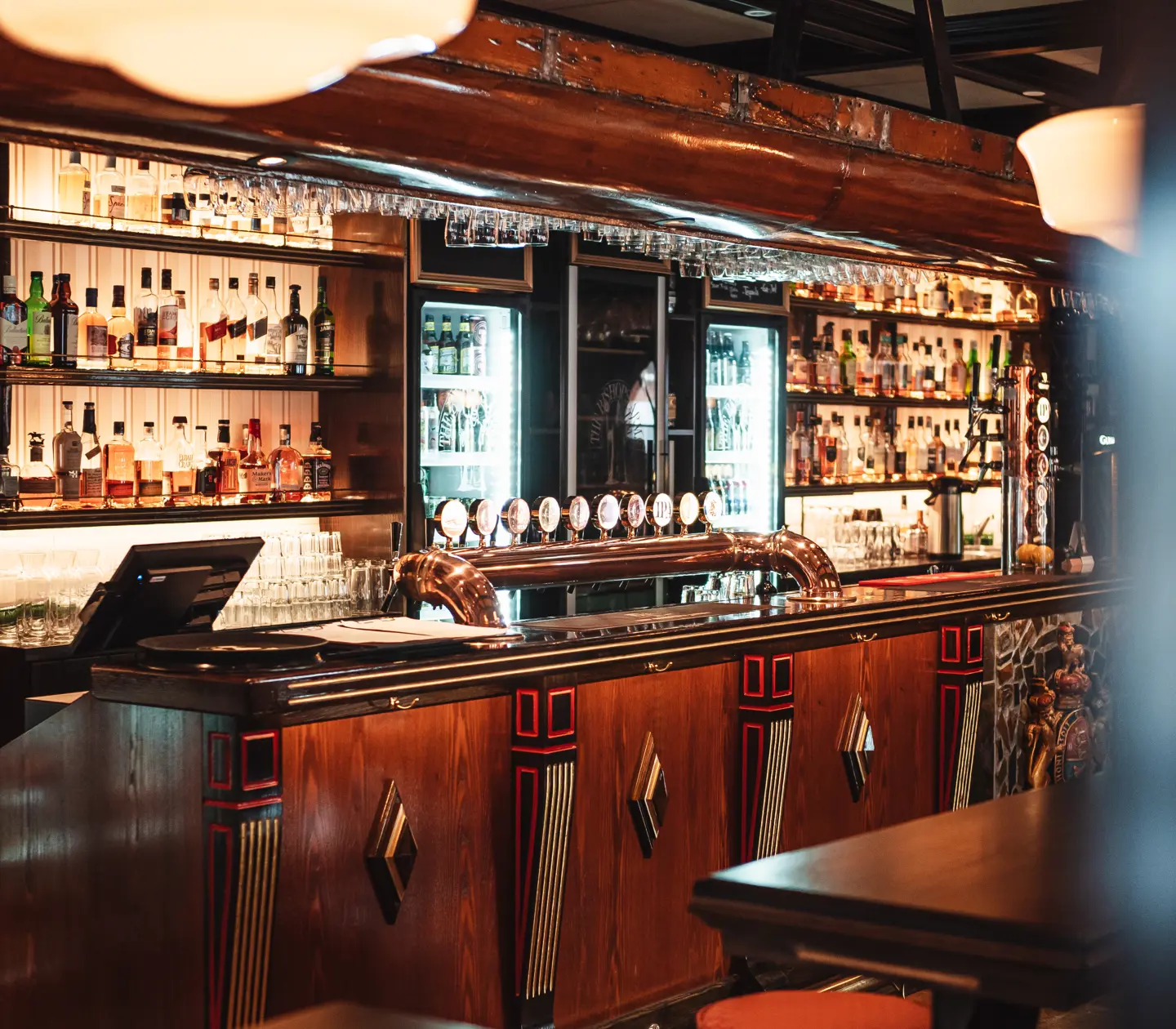 Pub environment with bar counter, glasses and bottles
