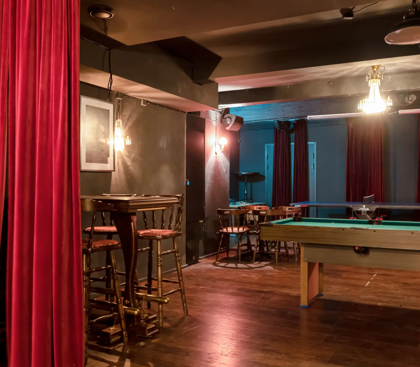 Pub environment with pool table, crystal chandeliers and seating