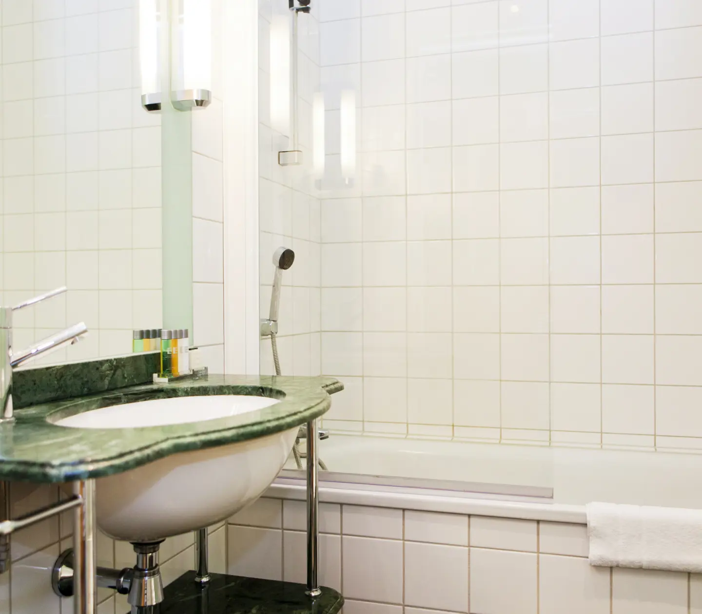 Bathroom with sink, bathtub and mirror