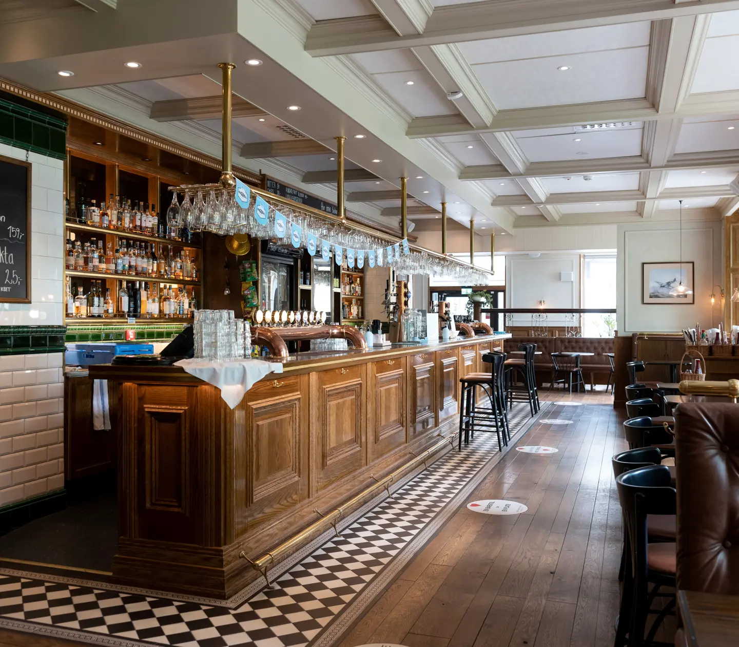 Bar environment with bar counter, bar stools and seating areas
