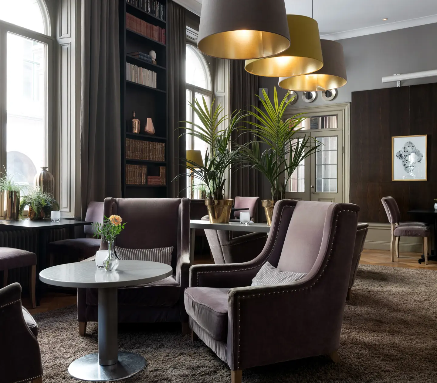 Bar environment with sofa groups, window and bookshelf